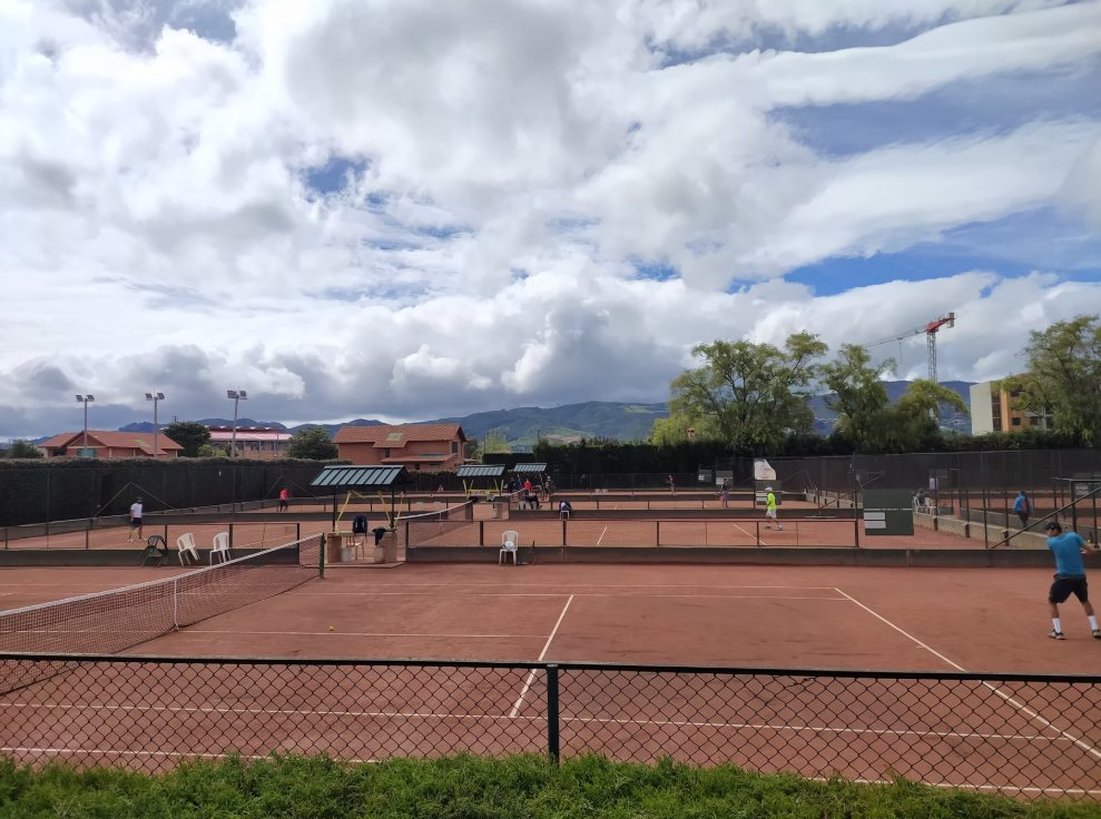 The club's clay courts, with the Sabana and the hills behind