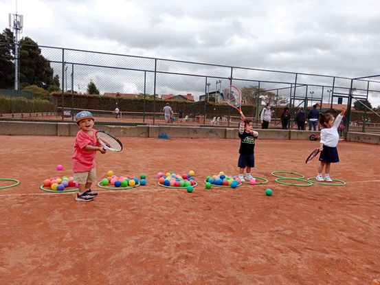 Children training on the tennis court